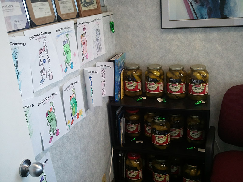 Photo of pickle jars and pictures.